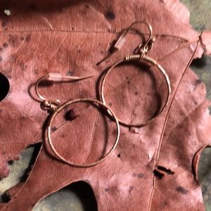 Two pairs of gold tone pierced earrings